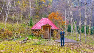 a man who sells expensive houses and builds huts in the mountains