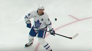 Matthews knocks puck ACROSS rink and then... 🎯