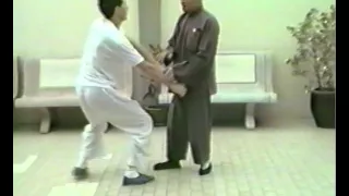 Grandmaster Huang Sheng Shyan (Master Huang Xingxian) with student