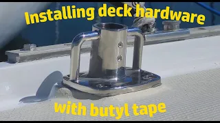 Installing deck hardware (stanchion base) with butyl tape.