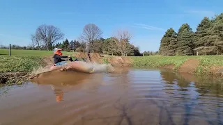 8 year old trying to water skip his polaris 120 snowmobile