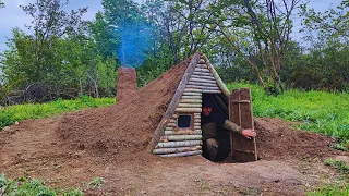 Building complete and warm survival shelter | Bushcraft earth hut, fireplace with clay