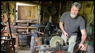 Sharpening implements with a foot treadle sharpening stone