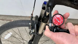 How to put air in a bike fork