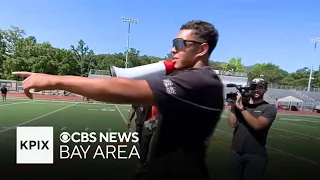 East Bay football star hosts skills camp