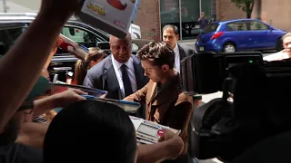 Tom Holland navigates through autographs arriving to Twitter HQ in NYC