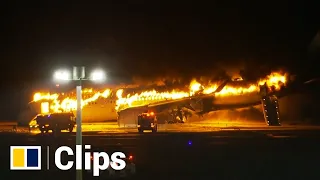 Japan Airlines flight catches fire after apparent collision with another plane at Haneda airport