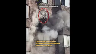 Firefighters rescue woman dangling outside burning NYC high-rise apartment building