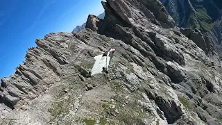 Wingsuit Pilot Glides Down Scenic Ridge - 1350888