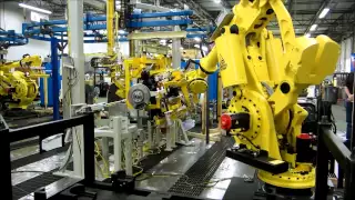 Material Handling - FANUC Robots for Transferring Axles to Conveyor Carriers