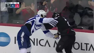 Mikhail Sergachev drop the gloves with Damon Severson, after Studenic crashes into Vasilevskiy