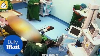 Incredible moment doctor suffers appendicitis during surgery