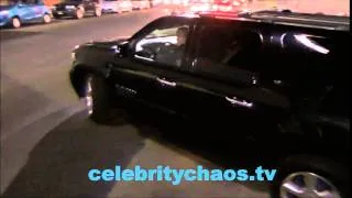 One Direction Harry Styles drives by fans in Hollywood