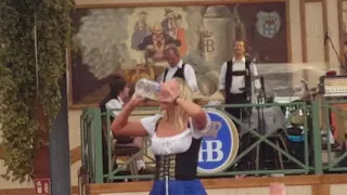 Girl downs a stein @ Hofbräuhaus  tent Oktoberfest 2016