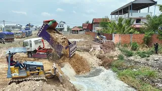 Pour soil to clear the lake, Processing By Bulldozer MITSUBISHI BD2F, Dump Truck Unloading