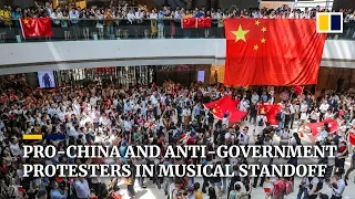 Pro-China and anti-government protesters in musical standoff