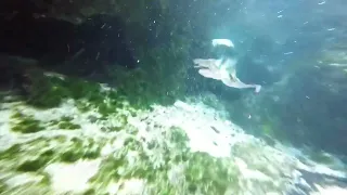 Swimming with mermaid in a cave