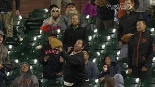 Fan is unable to grab foul ball with glove