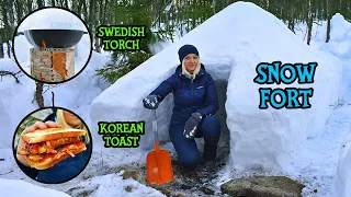 Making Korean Street food on Swedish torch in my Bushcraft Snow Fort in the woods