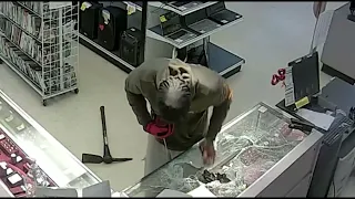 Robbers caught on video using pickaxe to steal jewelry from SE Houston pawn shop