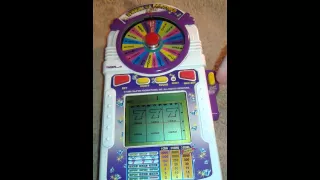 Rare 1998 Tiger Electronics wheel of Fortune slots lcd game