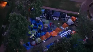 Anti-war protesters leave USC after police arrive, while Northeastern ceremony proceeds calmly