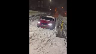 Quattro Power of Audi pulling BMW stuck in snow