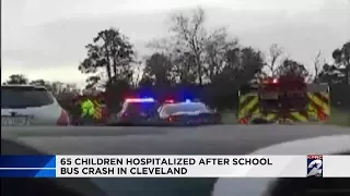 Dozens of children taken to hospital after bus crash