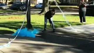 Baby gender reveal with basketball dunk