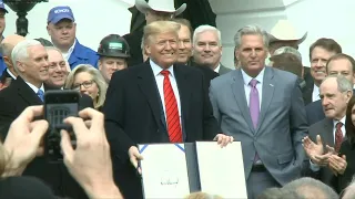 President Donald Trump signs USMCA trade agreement | AFP