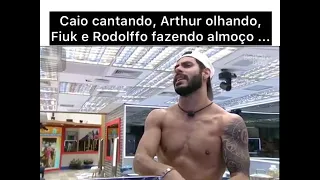 Caio cantando, Arthur olhando, Fiuk e Rodolffo fazendo almoço