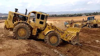 Super rare 1960s CAT 988 wheel loader with rock bucket moving rocks