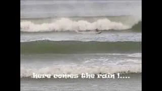 Hurricane: Bro rcSurfer surfing in heavy the wind and rain