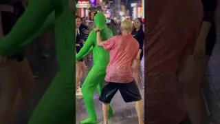 What this Green Man do on Pattaya Songkran Walking Street?