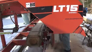 Cutting Red Oak stickers on the LT15. Frozen log.