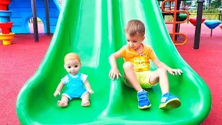 Vlad and Nikita play with Dolls on Outdoor playground