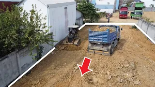 Bulldozer Spreading Land and  Dump Truck Unloading Land Filling in the new building