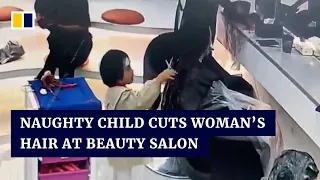 Naughty child cuts woman’s hair at beauty salon in China