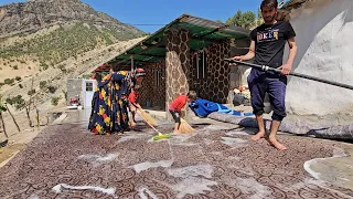 Village life Babak and Nargis wash the appliances to prepare to go to the new house.