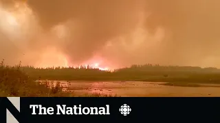 Wildfire near Yellowknife 'being held' as officials work on phased return plan