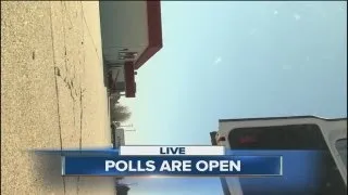 Wind blows over news camera