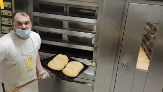 baking traditional Greek bread "lagana"...