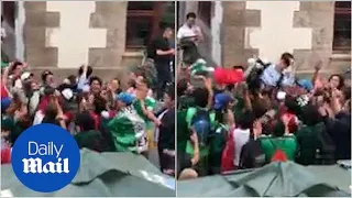 Mexico fans rejoice with South Korea fan after Germany knocked out