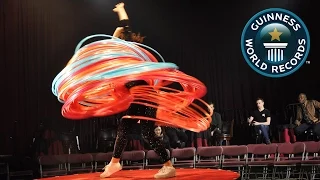 SPOTLIGHT - Most hula hoops spun simultaneously