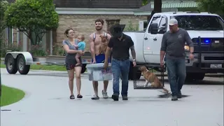 Family rescued Friday morning in Conroe where waters are still rising