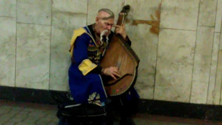 Old Ukrainian cossack playing bandura