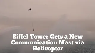 Helicopter Places New Mast on The Eiffel Tower in Paris, France