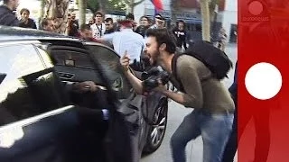 Protesters attack Spanish finance minister's car in Barcelona after political rally