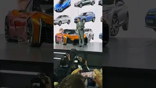 Toyota President Koji Sato on the stage with a new concept sports car!