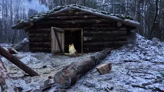 hiding in a huge dugout during a snow storm, spending the night in  bushcraft shelter * 18